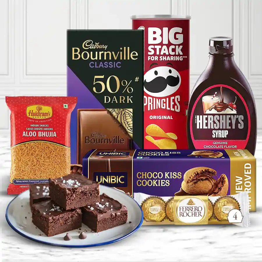 Fabulous Celebration Hamper filled with cookies, chips, Ferrero Rocher, brownies, chocolate syrup, dark milk chocolate, and Aloo Bhujia