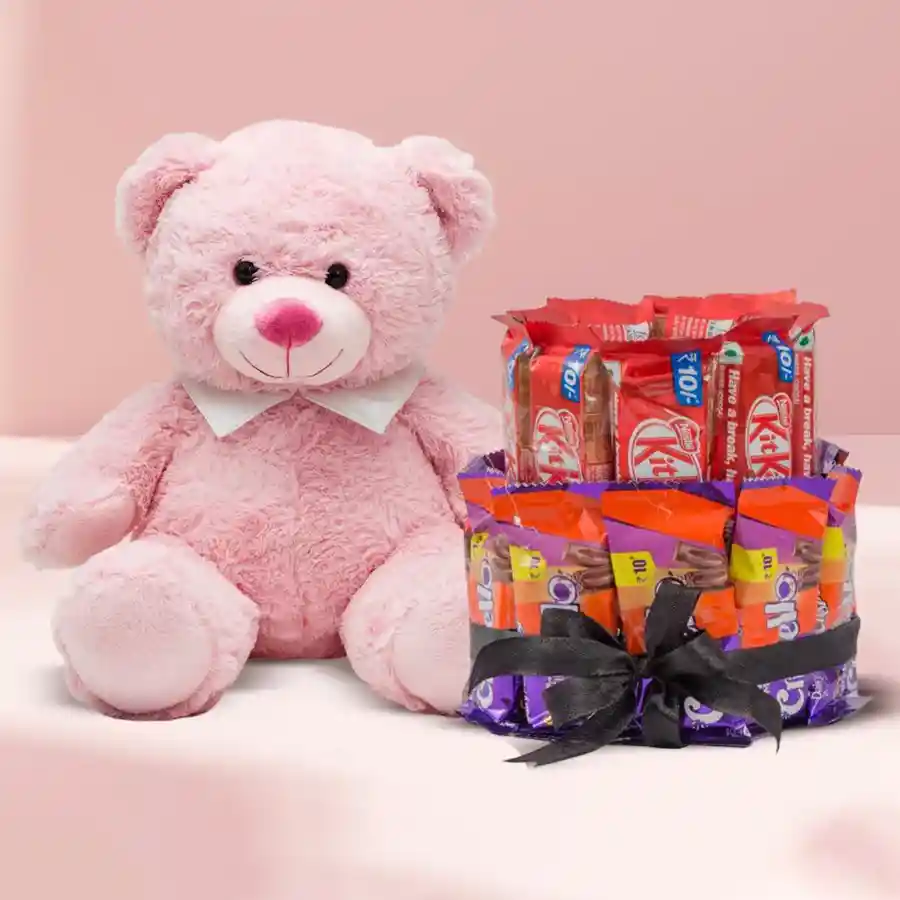 Special Double Deck Chocolate Arrangement with a Pink Teddy featuring Cadbury Crispello and Nestle KitKat chocolates, accompanied by a 12-inch pink plush teddy, elegantly tied with a ribbon.