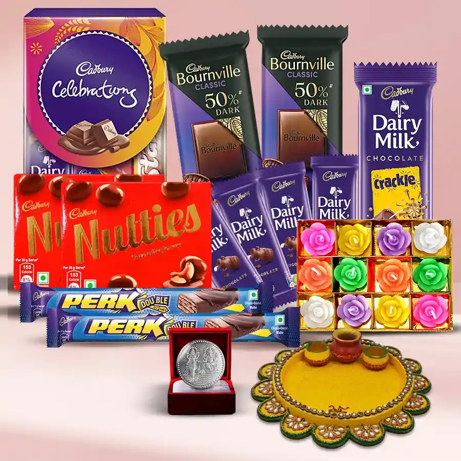 Remarkable Chocolates Gift Hamper for Diwali featuring Cadbury chocolates, a pooja thali, decorative wax candles, and a silver-plated Ganesh Laxmi coin.