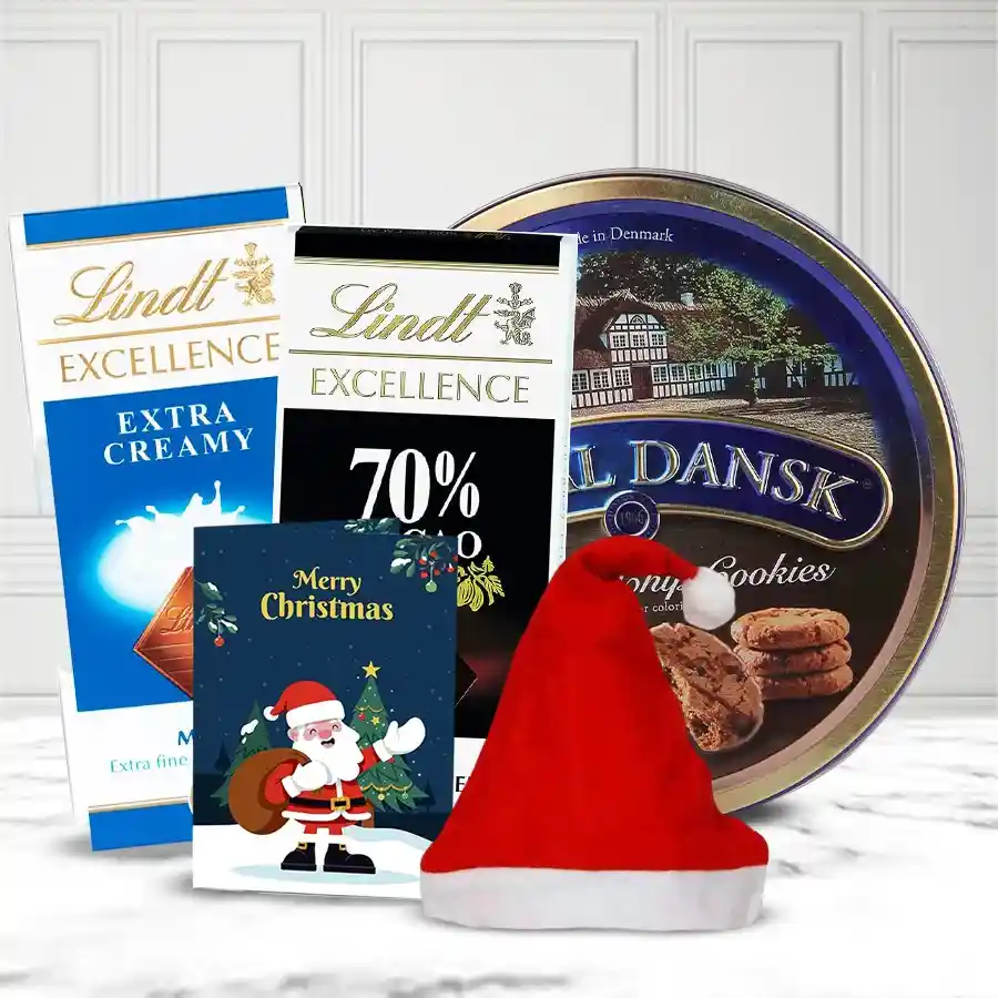 Mouth Watering Chcocos N Cookies Combo for Christmas featuring Royal Dansk Danish Cookies, Lindt Excellence chocolates, a Santa Claus cap, and a festive Christmas card