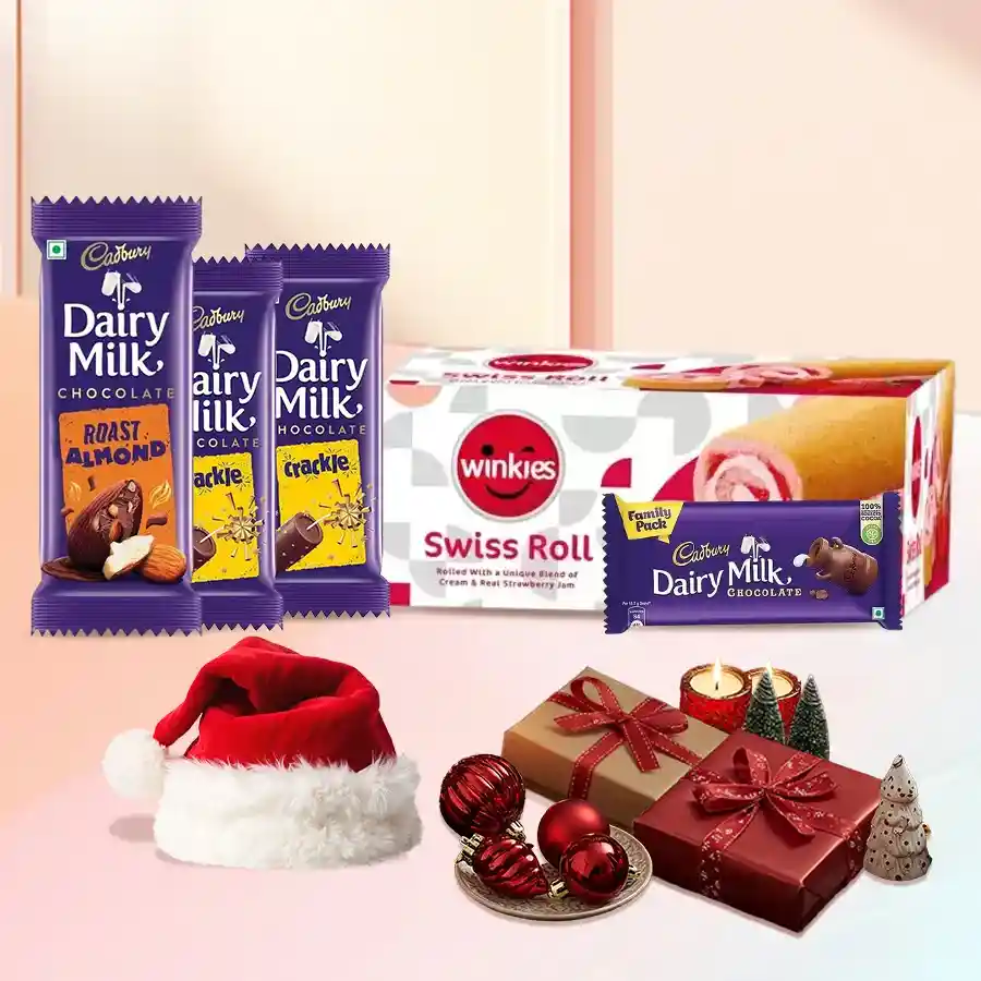 Wonderful Chocolates Gift Hamper featuring Cadbury Dairy Milk chocolates, Winkies Swiss Roll, a Santa cap, and festive decorations.
