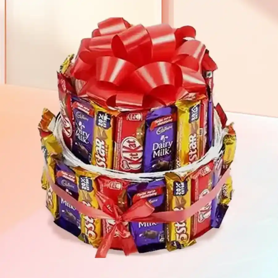 Yummy Choco Arrangement featuring Cadbury Dairy Milk bars, Nestle Kitkats, and Cadbury Five Stars in a festive package for Christmas