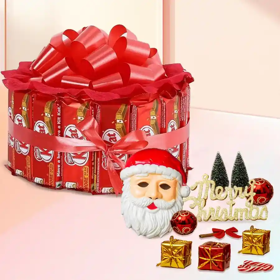 Wonderful Kitkat Arrangement featuring 15 Round Nestle KitKats bundled with a red ribbon, a Santa Claus mask, and festive decorations.