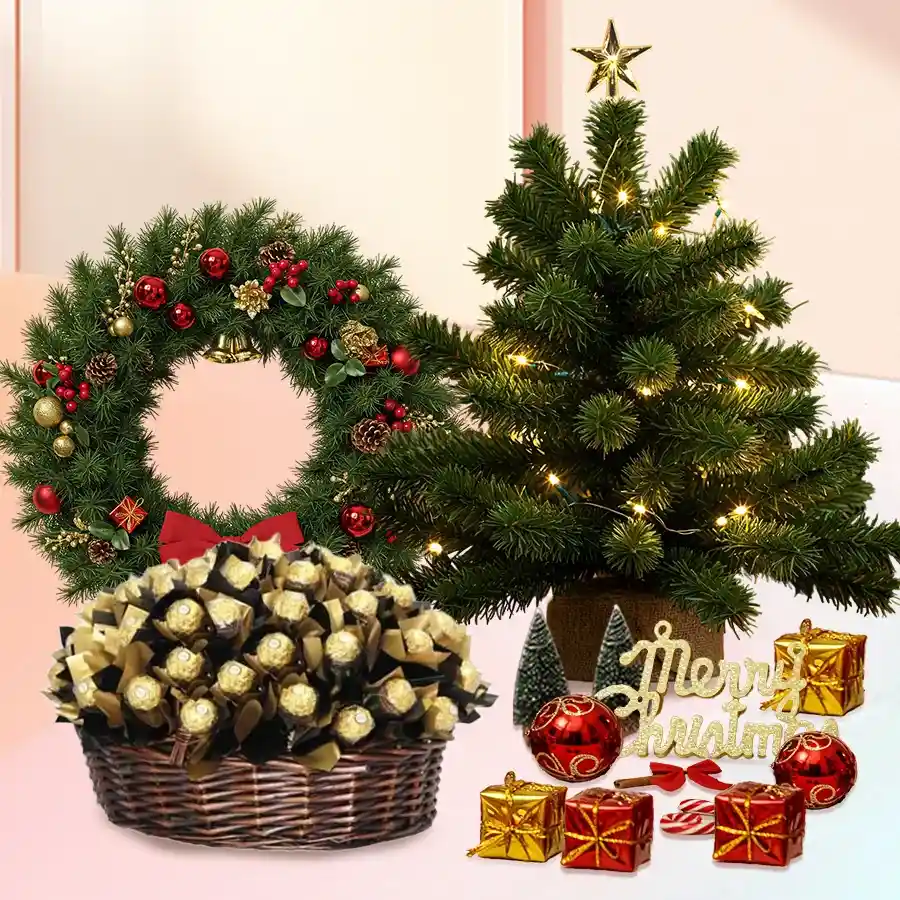 Elegant basket filled with 32 Ferrero Rocher chocolates, a small Christmas tree, decorative wreath, and festive holiday decorations.