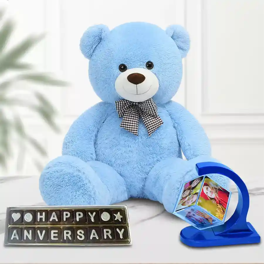 Personalized photo revolving stand with a love teddy and handmade chocolates for an anniversary gift combo.