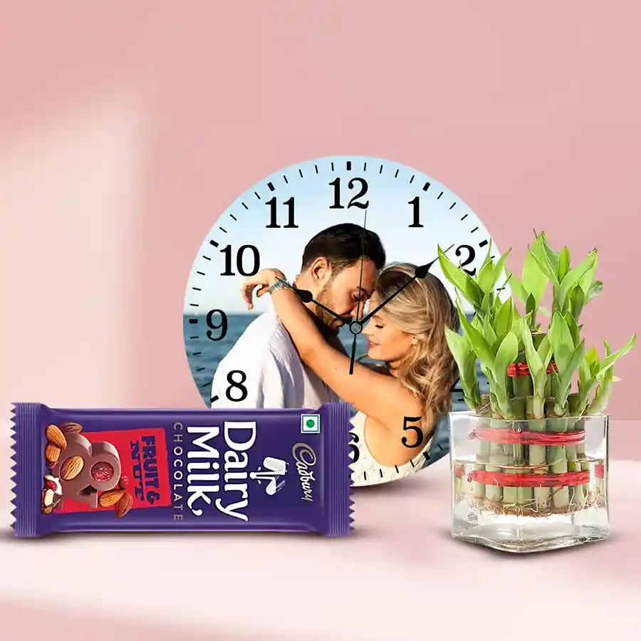 Amusing personalized photo wall clock with a 2-tier Lucky Bamboo plant and a Cadbury Dairy Milk Fruit n Nut chocolate bar
