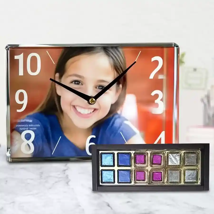 Personalized rectangular glass table clock displaying a cherished photo alongside a box of handcrafted fruit-filled chocolates