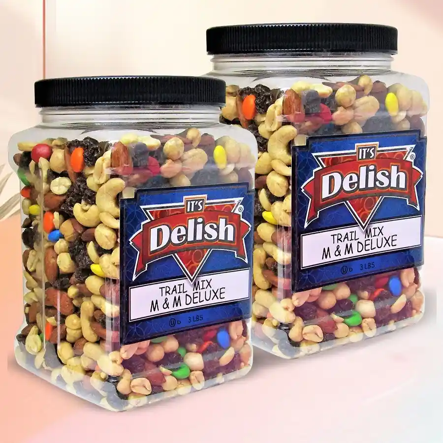 Twin jars of trail mix and candies tied with festive ribbons, filled with colorful M&M's and crunchy trail mix.