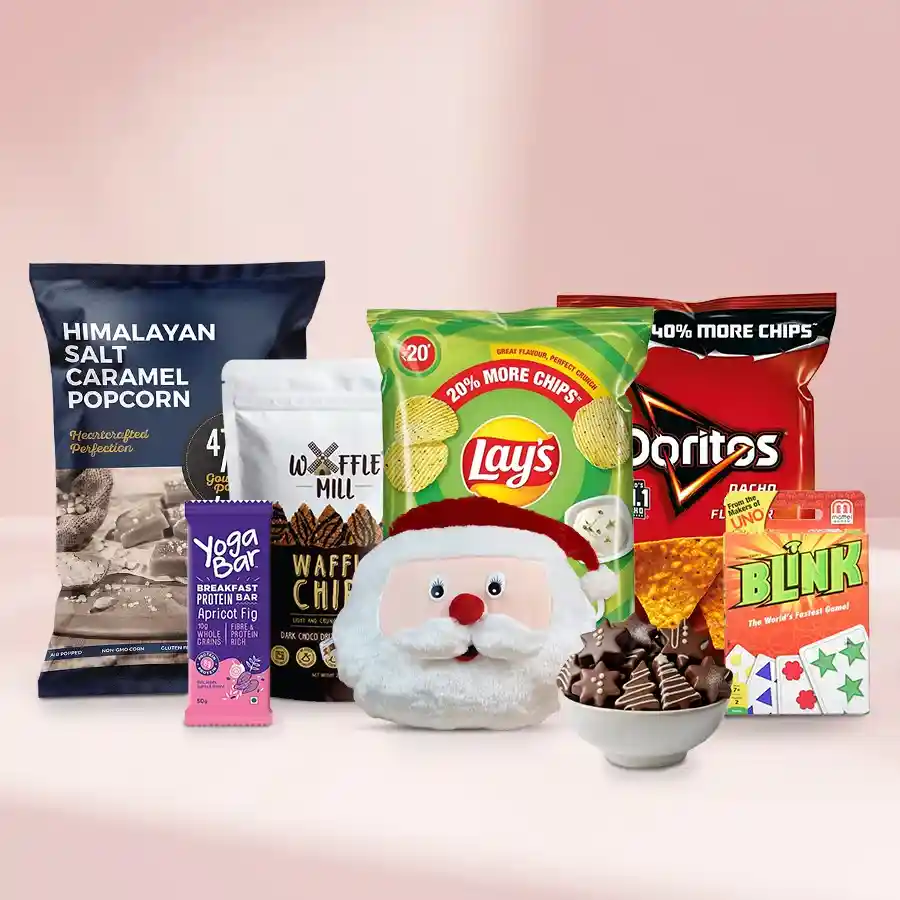 Deluxe Chocolate Bites Xmas Gift Basket featuring handmade chocolates, popcorn, chips, a Yoga Protein Bar, and Mattel game set.