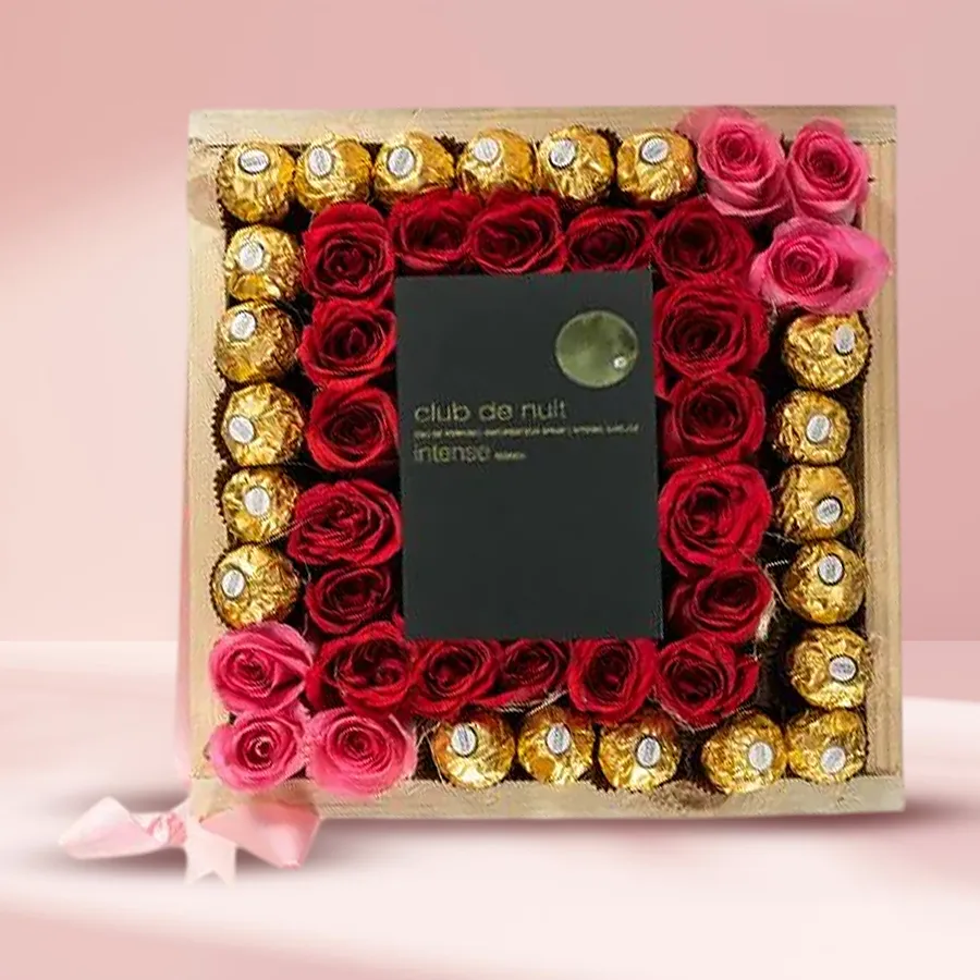 Seductive Valentine gift basket featuring Club Nuit perfume, Ferrero Rocher chocolates, and artificial roses in a wooden tray