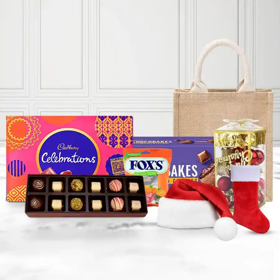 Exquisite Chocolate and Christmas Decorations Gift Hamper with Cadbury products, handmade chocolates, festive ornaments, and jute bag
