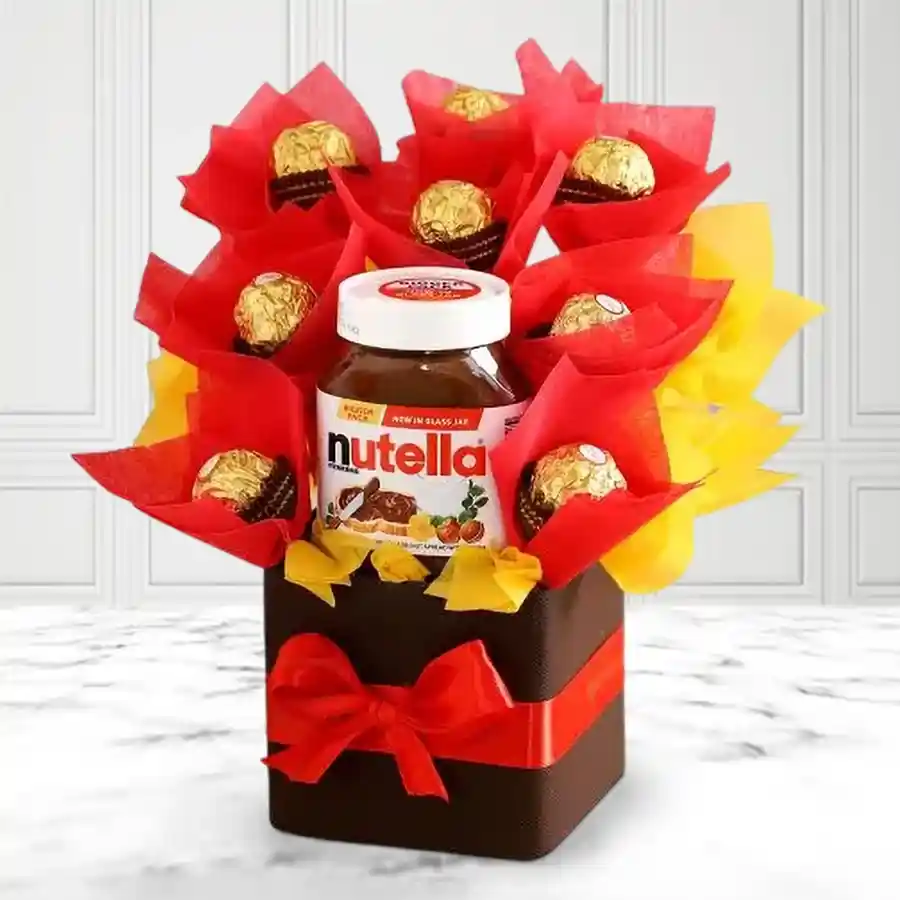 Feisty Ferrero Rocher Christmas Arrangement featuring a 180g jar of Nutella and eight Ferrero Rocher chocolates beautifully packaged for the holiday season
