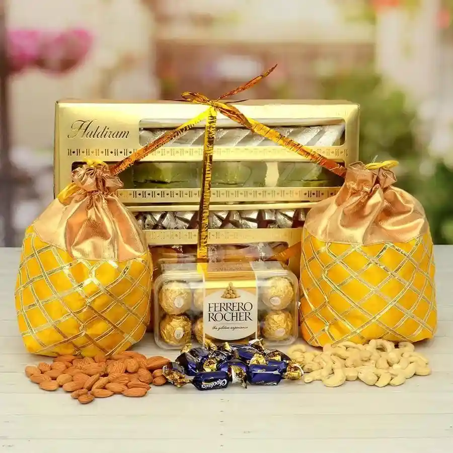Haldiram Sweets basket with Ferrero Rocher chocolates, nuts, and Cadbury Eclairs