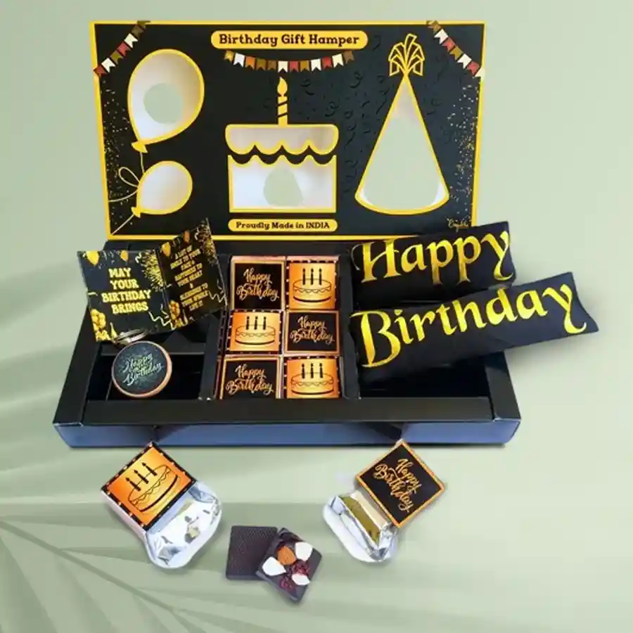 Exotic Happy Birthday Chocolate and Gift Box featuring premium chocolates, wooden keychain, golden foil birthday sash, and greeting card in a high-quality gift box.