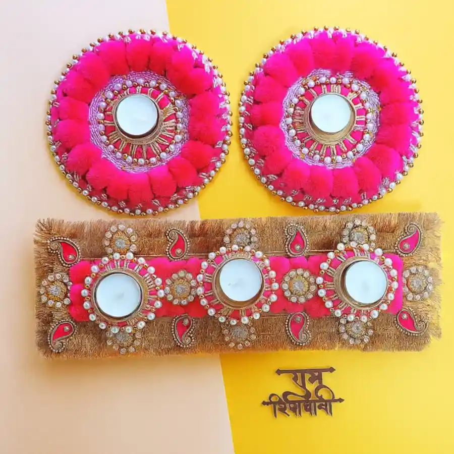 Set of 5 designer T-light candles in elegant holders with unique designs, arranged aesthetically on a table